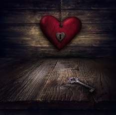 Valentines design - Locked Heart in chains. Love concept Illustration with heart hanging on chains with keyhole and vintahe key on wooden background.